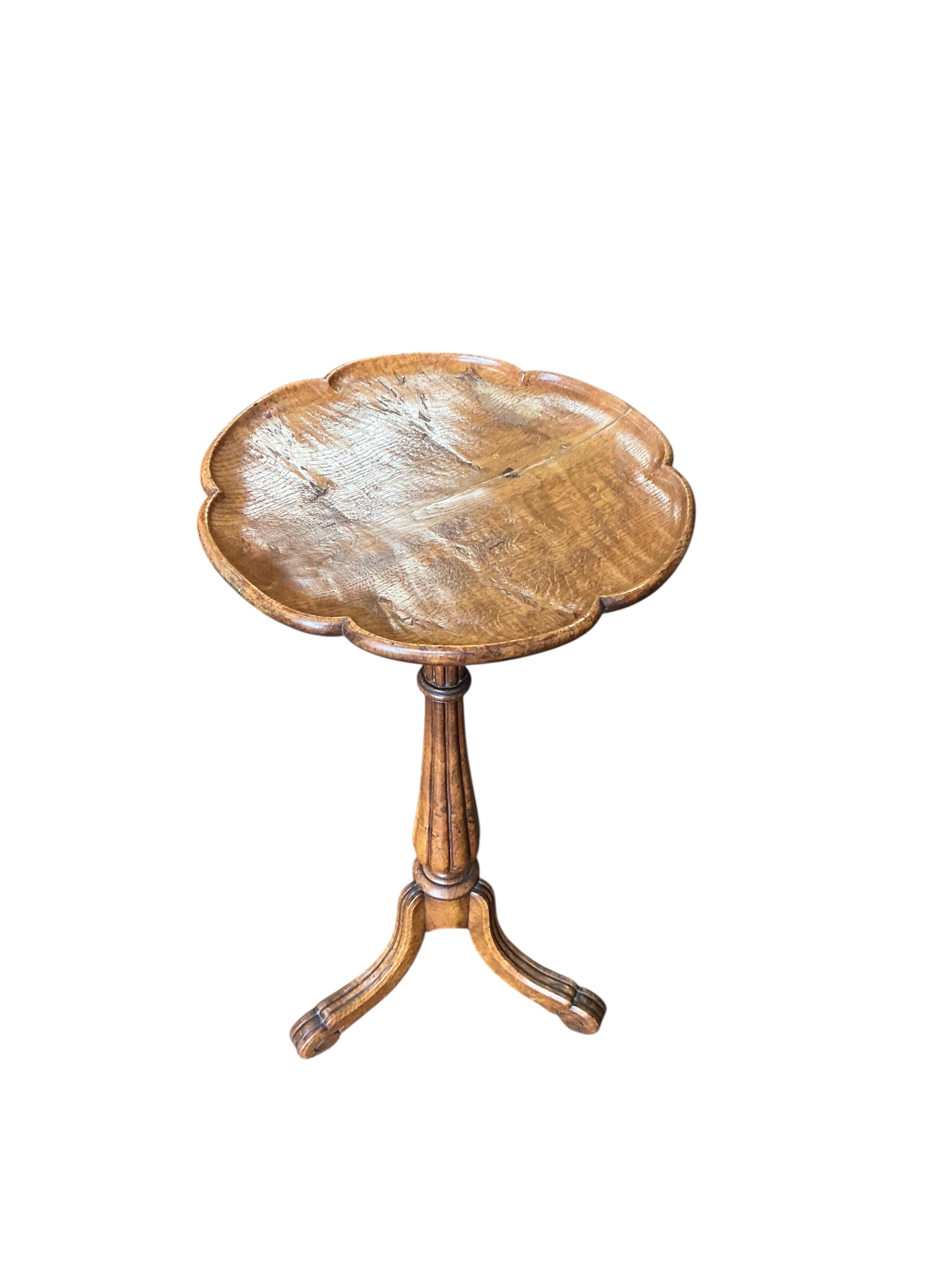 A Victorian circular elm tripod wine table, diameter 36cm, height 72cm